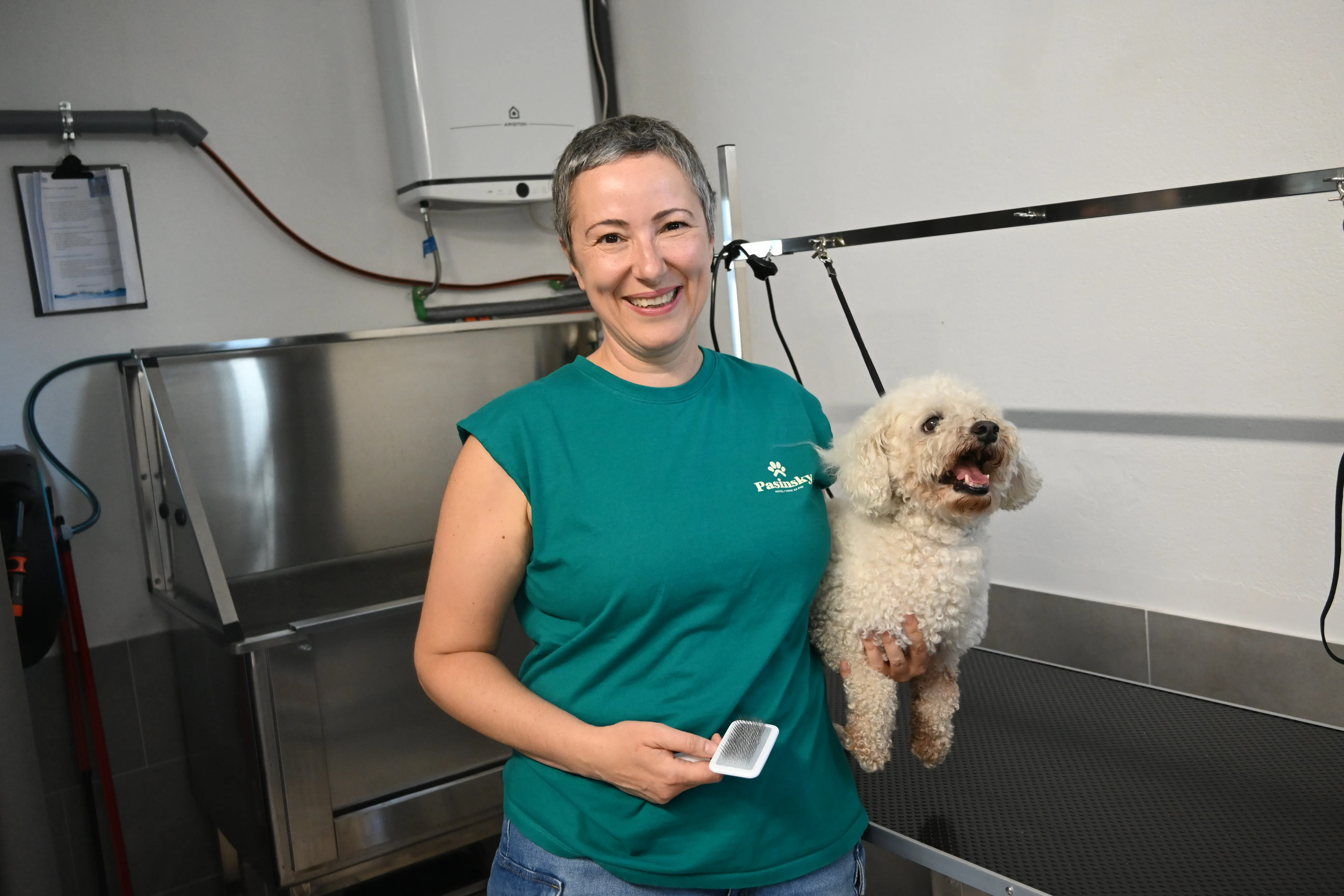 Grooming professional with dog